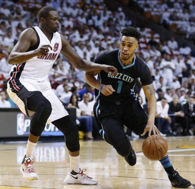 Charlotte Hornets guard Courtney Lee (1) drives past Miami Heat forward Luol Deng (9) during the first half in Game 5 of an NBA basketball playoffs first-round series, Wednesday, April 27, 2016, in Miami. AP