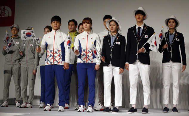 South Korean Olympic athletes and models present the South Korean Olympic team uniforms for the 2016 Rio de Janeiro Olympic Games at Korean National Training Center in Seoul, South Korea, Wednesday, April 27, 2016. South Korea's Olympic committee on Wednesday unveiled long-sleeved shirts and pants it says will help protect the country's Olympic athletes from the mosquito-borne Zika virus at this year's games in Rio de Janeiro. AP