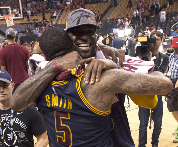 Cleveland Cavaliers forward LeBron James celebrates the team's win over the Toronto Raptors with J.R. Smith after Game 6 of the NBA basketball Eastern Conference finals, Friday, May 27, 2016, in Toronto. The Cavaliers won 113-87 and advanced to the NBA Finals. (Frank Gunn/The Canadian Press via AP)