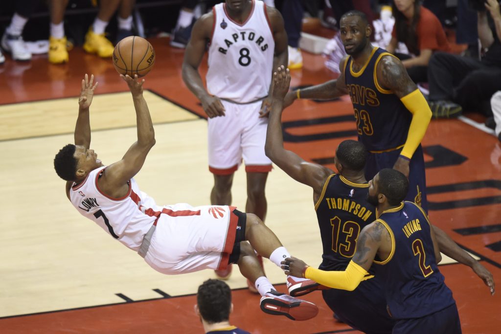 Toronto Raptors guard Kyle Lowry shoots as he falls to the floor after being fouled by Cleveland Cavaliers guard Tristan Thompson (13) during the second half of Game 3 of the NBA basketball Eastern Conference finals in Toronto on Saturday, May 21, 2016. (Frank Gunn/The Canadian Press via AP) MANDATORY CREDIT