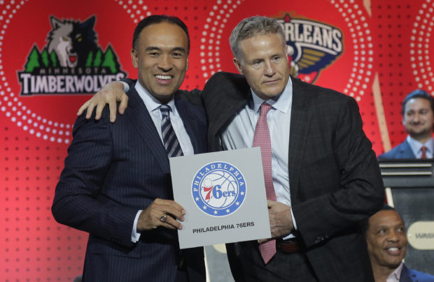 NBA deputy commissioner Mark Tatum, left, poses for a photo with Philadelphia 76ers head coach Brett Brown during the NBA basketball draft lottery, Tuesday, May 17, 2016, in New York. The 76ers won the top pick in this year's draft. (AP Photo/Julie Jacobson)