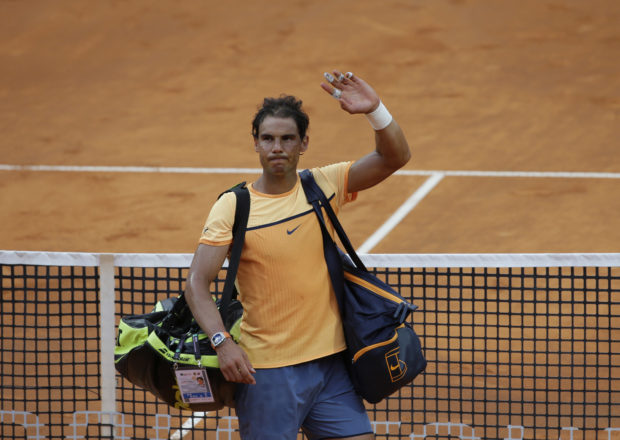 Rafael Nadal of Spain waves as he leaves after losing his quarter final match against Novak Djokovic of Serbia at the Italian Open tennis tournament, in Rome, Friday, May 13, 2016. Djokovic won 7-5, 7-6. (AP Photo/Alessandra Tarantino)