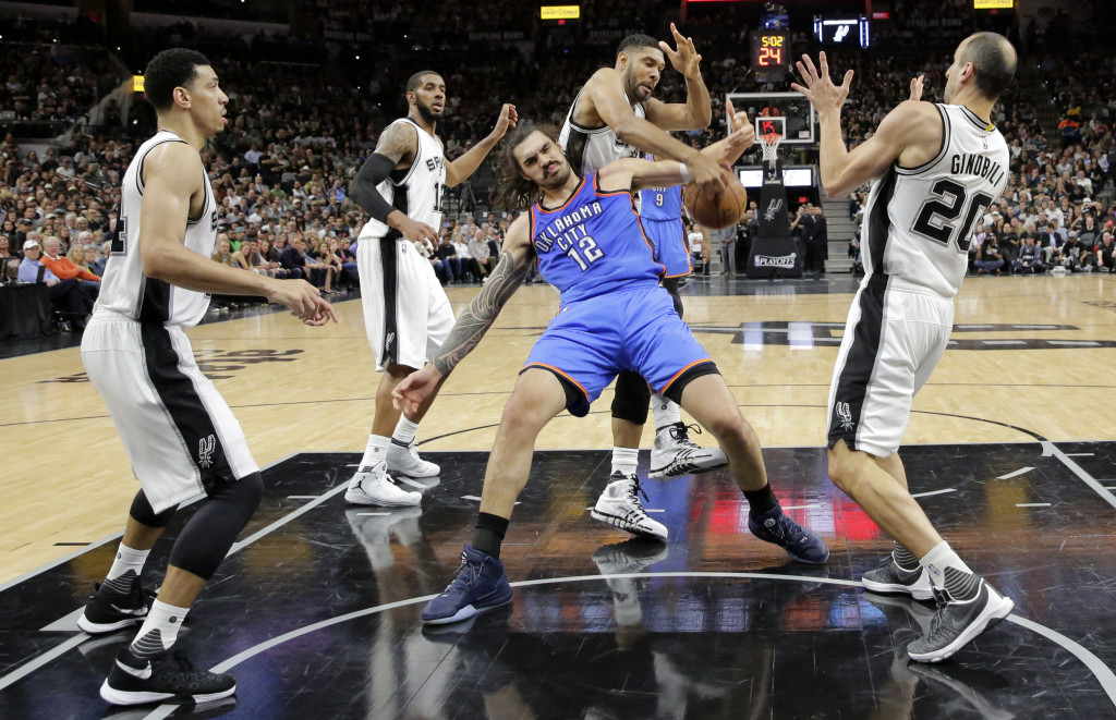 San Antonio Spurs' Danny Green, left, LaMarcus Aldridge, and Manu Ginobili (20) watch Tim Duncan (21) strip the ball from -Oklahoma City Thunder's Steven Adams (12) during the first half in Game 2 of a second-round NBA basketball playoff series, Monday, May 2, 2016, in San Antonio. (AP Photo/Eric Gay)