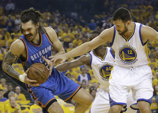 Oklahoma City Thunder center Steven Adams, left, is guarded by Golden State Warriors center Andrew Bogut during the first half of Game 1 of the NBA basketball Western Conference finals in Oakland, Calif., Monday, May 16, 2016. (AP Photo/Marcio Jose Sanchez)