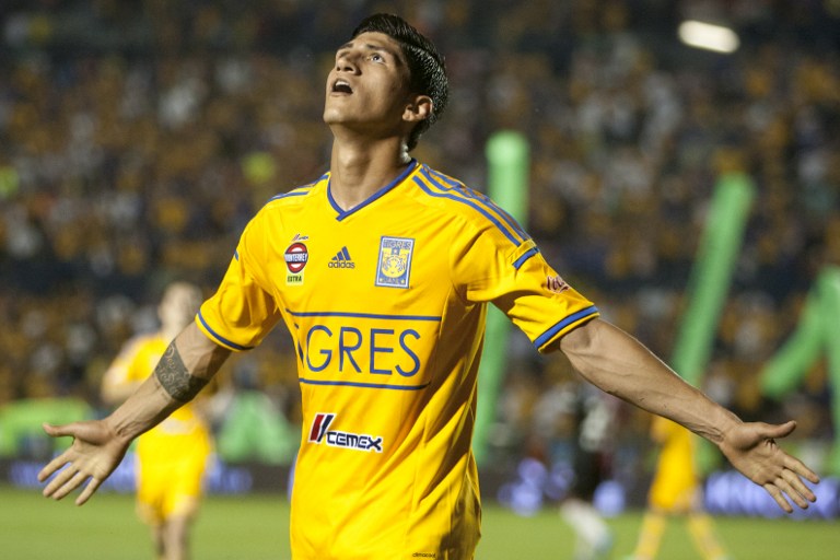(FILES) This file photo taken on April 26, 2014 shows Tigre's Alan Pulido celebrating after scoring against Atlas during their 2014 Mexican Clausura tournament football match in Monterrey. Mexican footballer Alan Pulido was rescued by Mexican authorities on May 30 after being allegedly taken by armed kidnappers in the northern Mexican border state of Tamaulipas on May 29. / AFP PHOTO / Julio Cesar Aguilar Fuentes