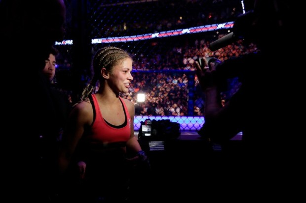 NEWARK, NJ - APRIL 18: Paige VanZant celebrates defeating Felice Herrig in their women's strawweight bout during the UFC Fight Night event at Prudential Center on April 18, 2015 in Newark, New Jersey.   Alex Trautwig/Getty Images/AFP