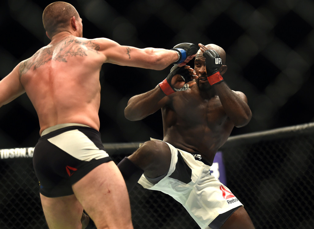 Elvis Mutapcic, left, fights Kevin Casey during UFC 199 at the Forum in Inglewood, Calif., Saturday June 4, 2016. Casey, Muhammad Ali's son-in-law fought to a majority draw in a UFC bout one day after Ali's death. (Hans Gutknecht/Los Angeles Daily News via AP)  NO SALES; MAGS OUT; HILLS OUT, LOS ANGELES TIMES OUT; VENTURA COUNTY STAR OUT ANTELOPE VALLEY PRESS OUT; MANDATORY CREDIT