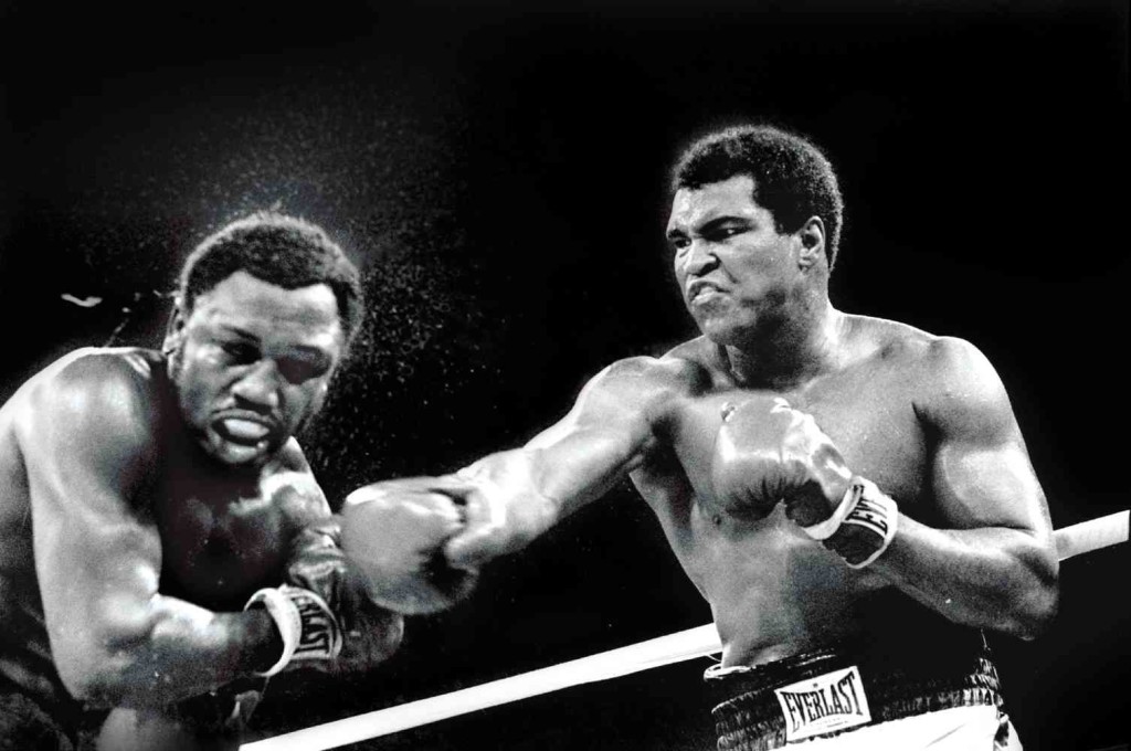 ‘THRILLA IN MANILA’ Muhammad Ali connects with a right to Joe Frazier’s head in the ninth round of their heavyweight title fight, billed as “Thrilla in Manila,” on Oct. 1, 1975. Ali, who won by technical knockout in the 14th round after Frazier failed to answer the bell for the 15th round, died on Friday in Phoenix, Arizona, at age 74.  AP