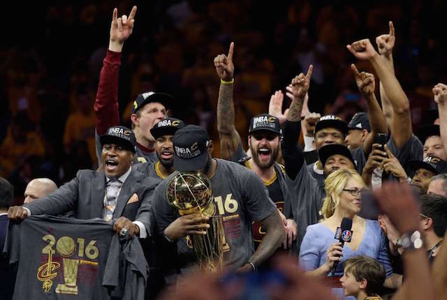 Cleveland Cavaliers forward LeBron James, center, celebrates with teammates after Game 7 of basketball's NBA Finals against the Golden State Warriors in Oakland, Calif., Sunday, June 19, 2016. The Cavaliers won 93-89. AP