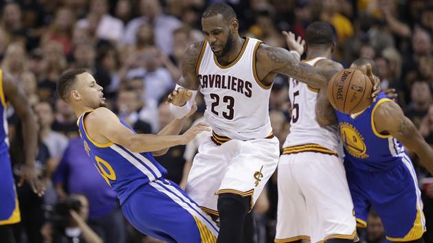 Cavaliers forward LeBron James and Warriors guard Stephen Curry collide during the first half of Game 6 of the NBA Finals in Cleveland, June 16, 2016. AP