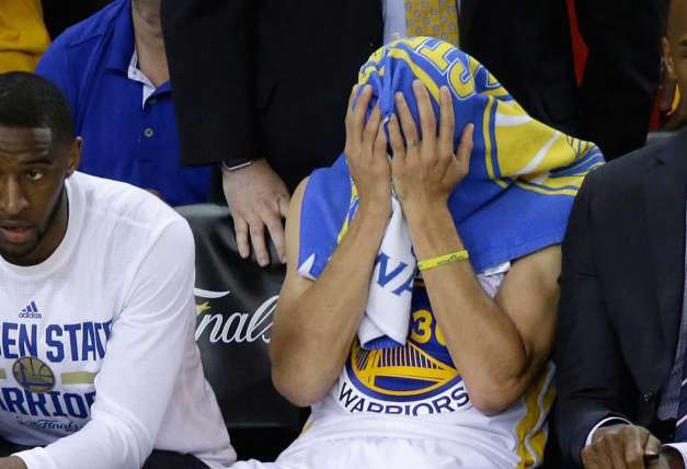 Golden State Warriors guard Stephen Curry (30) sits on the bench during the second half of Game 7 of basketball's NBA Finals between the Warriors and the Cleveland Cavaliers in Oakland, Calif., Sunday, June 19, 2016. The Cavaliers won 93-89 to win the series. AP