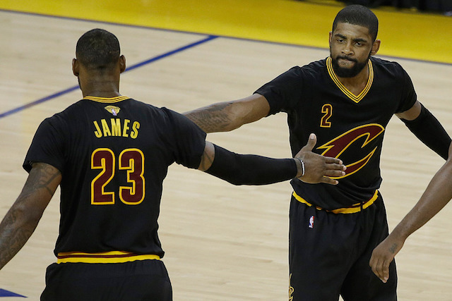 LeBron James and Kyrie Irving celebrate during the Cleveland Cavaliers' Game 5 win in the 2016 NBA Finals. James and Irving both scored 41 points to beat the Golden State Warriors. AP