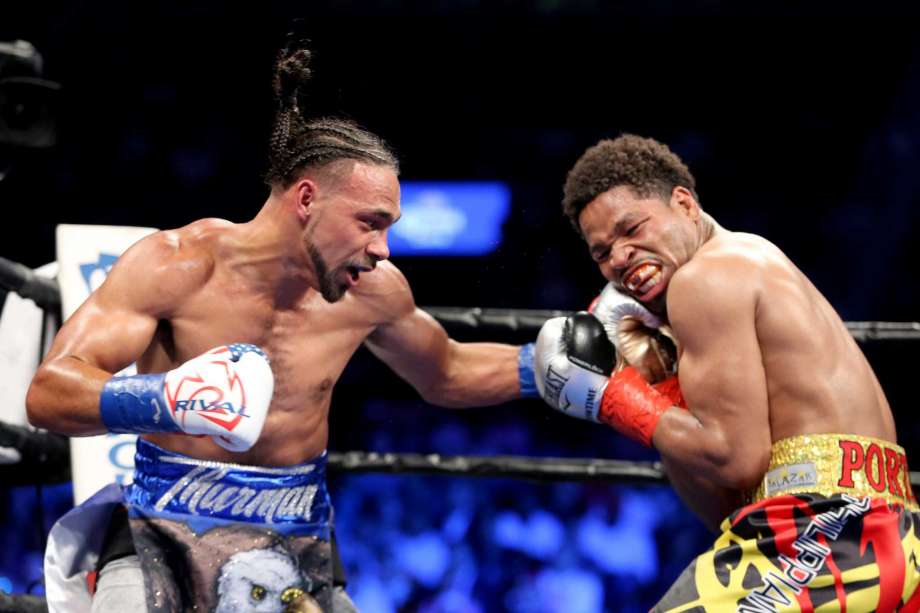 Keith Thurman lands a left hand against Shawn Porter during their WBA Welterweight title fight at the Barclays Center in Brooklyn, New York, Saturday, June 25, 2016. Thurman won via unanimous decision to retain his title. AP