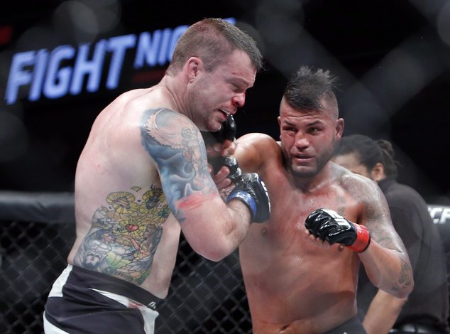 Steve Bosse, right, lands a punch to the head of Sean O'Connell during their UFC light heavyweight mixed martial arts bout Saturday, June 18, 2016, in Ottawa, Ontario. Fred Chartrand/The Canadian Press via AP