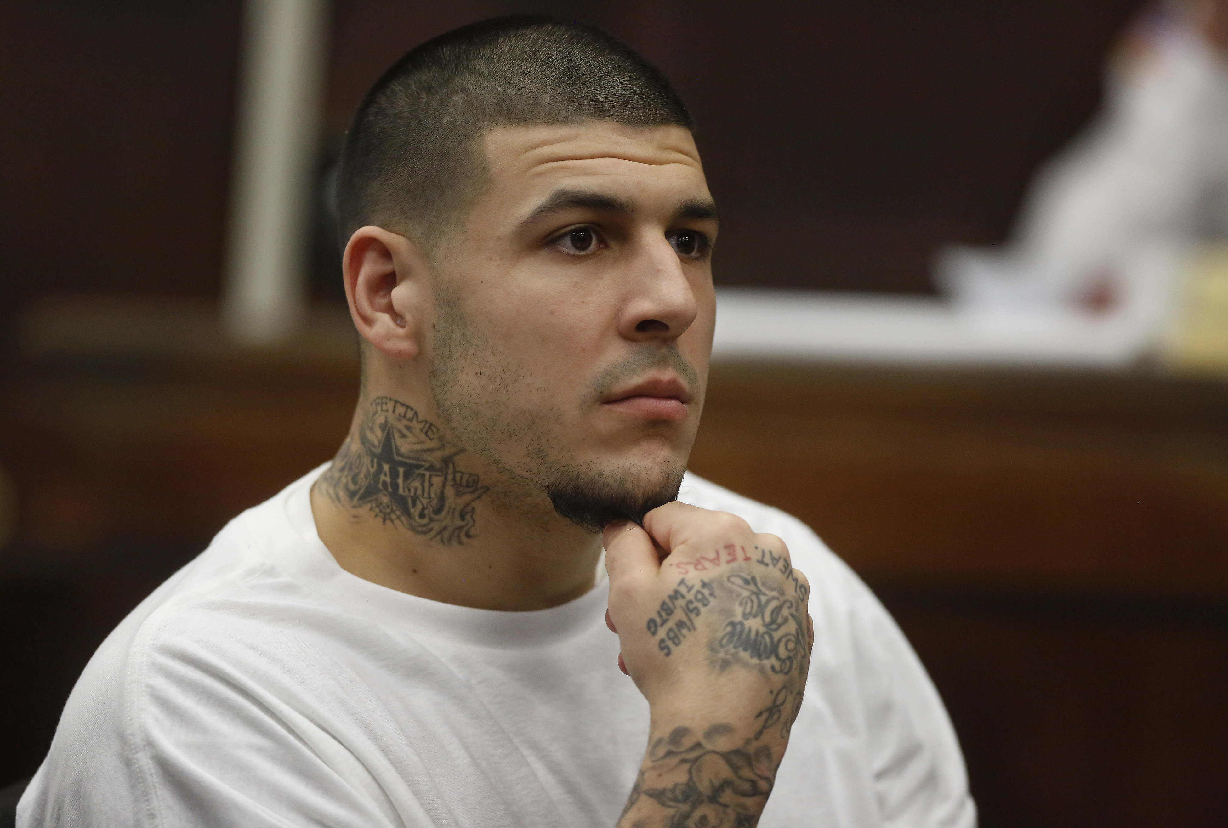 FILE - In this Dec. 22, 2015 file photo, former New England Patriots NFL football player Aaron Hernandez attends a pre-trial hearing at Suffolk Superior Court in Boston. Hernandez is expected to appear in court Thursday, July 21, 2016, with new lawyers to defend him in the 2012 slayings of two men outside a Boston nightclub. (AP Photo/Steven Senne, Pool, File)