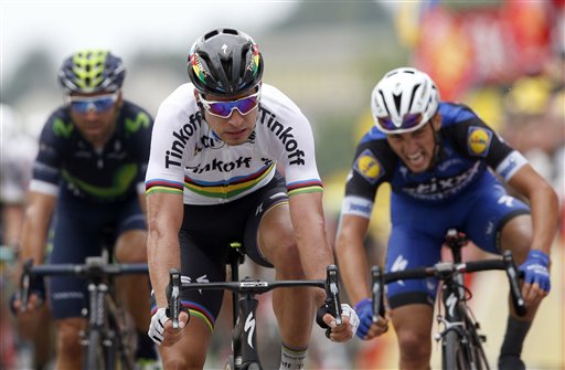 Peter Sagan of Slovakia, center, crosses the finish line ahead of Frances Julian Alaphilippe, right,  to win the second stage of the Tour de France cycling race over 183 kilometers (113.7 miles) with start in Saint-Lo and finish in Cherbourg-en-Cotentin, France, Sunday, July 3, 2016. (AP Photo/Christophe Ena)