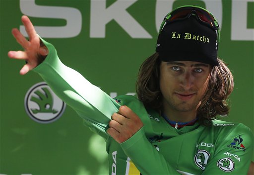 Peter Sagan of Slovakia, puts on the best sprinter's green jersey on the podium after winning the sixteenth stage of the Tour de France cycling race over 209 kilometers (129.9 miles) with start in Moirans-en-Montagne and finish in Bern, Switzerland, Monday, July 18, 2016. (AP Photo/Peter Dejong)