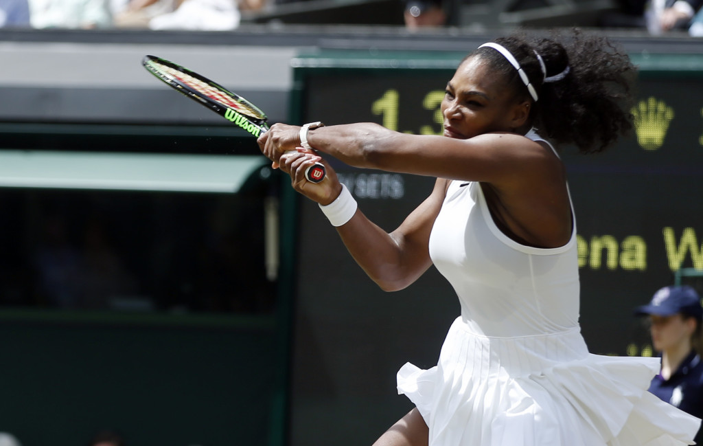 Serena Williams of the U.S returns to Annika Beck of Germany during their women's singles match on day seven of the Wimbledon Tennis Championships in London, Sunday, July 3, 2016. (AP Photo/Alastair Grant)