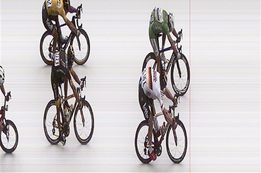 In this photo finish image released by A.S.O. Monday, July 4, 2016, Britain's Mark Cavendish, top right, pushes his bicycle over the finish line ahead of second placed Germany's Andre Greipel, bottom right, third placed Brian Coquard of France, bottom left,  and fourth placed Peter Sagan of Slovakia, top left, to win the third stage of the Tour de France cycling race over 223.5 kilometers (138.6 miles) with start in Granville and finish in Angers, France. (A.S.O. via AP)