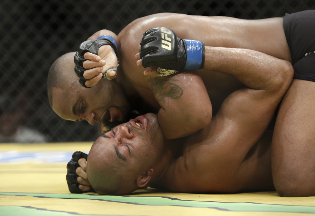 Daniel Cormier, top, fights Anderson Silva during their light heavyweight mixed martial arts bout at UFC 200, Saturday, July 9, 2016, in Las Vegas. (AP Photo/John Locher)
