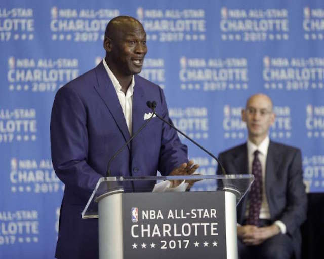 Charlotte Hornets owner Michael Jordan, left, speaks as NBA Commissioner Adam Silver, right, listens during a news conference, Tuesday, June 23, 2015, to announce Charlotte, N.C., as the site of the 2017 NBA All-Star basketball game. AP
