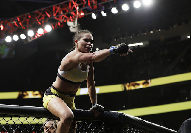 Amanda Nunes celebrates after defeating Miesha Tate during their women's bantamweight championship mixed martial arts bout at UFC 200, Saturday, July 9, 2016, in Las Vegas. AP