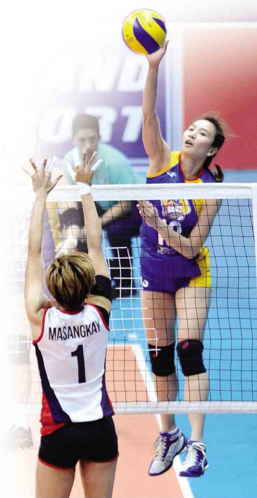 RACHEL Daquis of RC Cola (right) scores off Petron’s Mary Grace Masangkay in their Superliga duel yesterday.  AUGUST DELA CRUZ