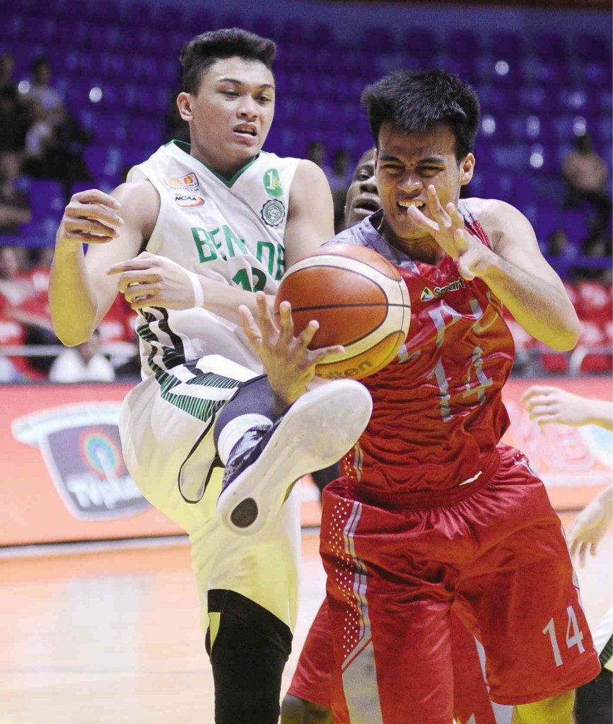 IKE Serafica of LPU tries  to protect the ball from Gerald Castor of CSB . AUGUST DELA CRUZ