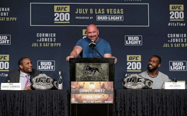 Dana White, center, stands between Daniel Cormier, left, and Jon Jones during a UFC 200 mixed martial arts news conference, Wednesday, July 6, 2016, in Las Vegas. Cormier and Jones are scheduled to fight in a light heavyweight championship fight at UFC 200 on Saturday. AP