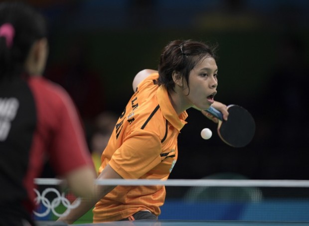 Philippines' Ian Lariba hits a shot in her women's singles qualification round table tennis match at the Riocentro venue during the Rio 2016 Olympic Games in Rio de Janeiro on August 6, 2016. / AFP PHOTO / Juan Mabromata