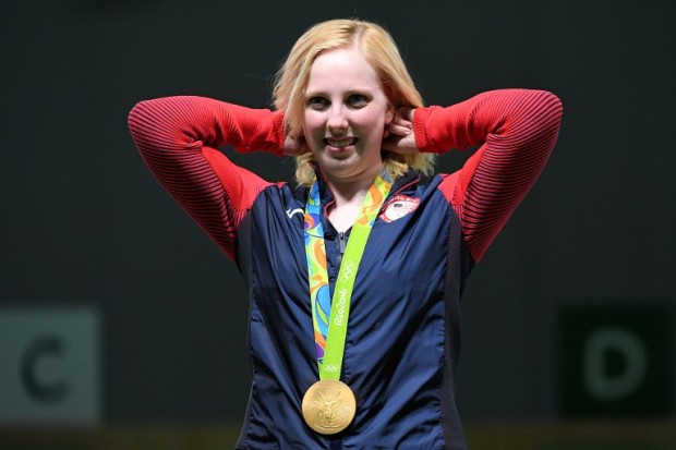 USA's gold medallist Virginia Thrasher poses on the podium during the medal ceremony for the women's 10m air rifle shooting event at the Rio 2016 Olympic Games at the Olympic Shooting Centre in Rio de Janeiro on August 6, 2016. / AFP PHOTO / Pascal GUYOT