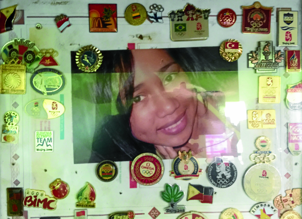 Hidilyn Diaz loves to collect pins from all over the country and used it as a frame to her photos.