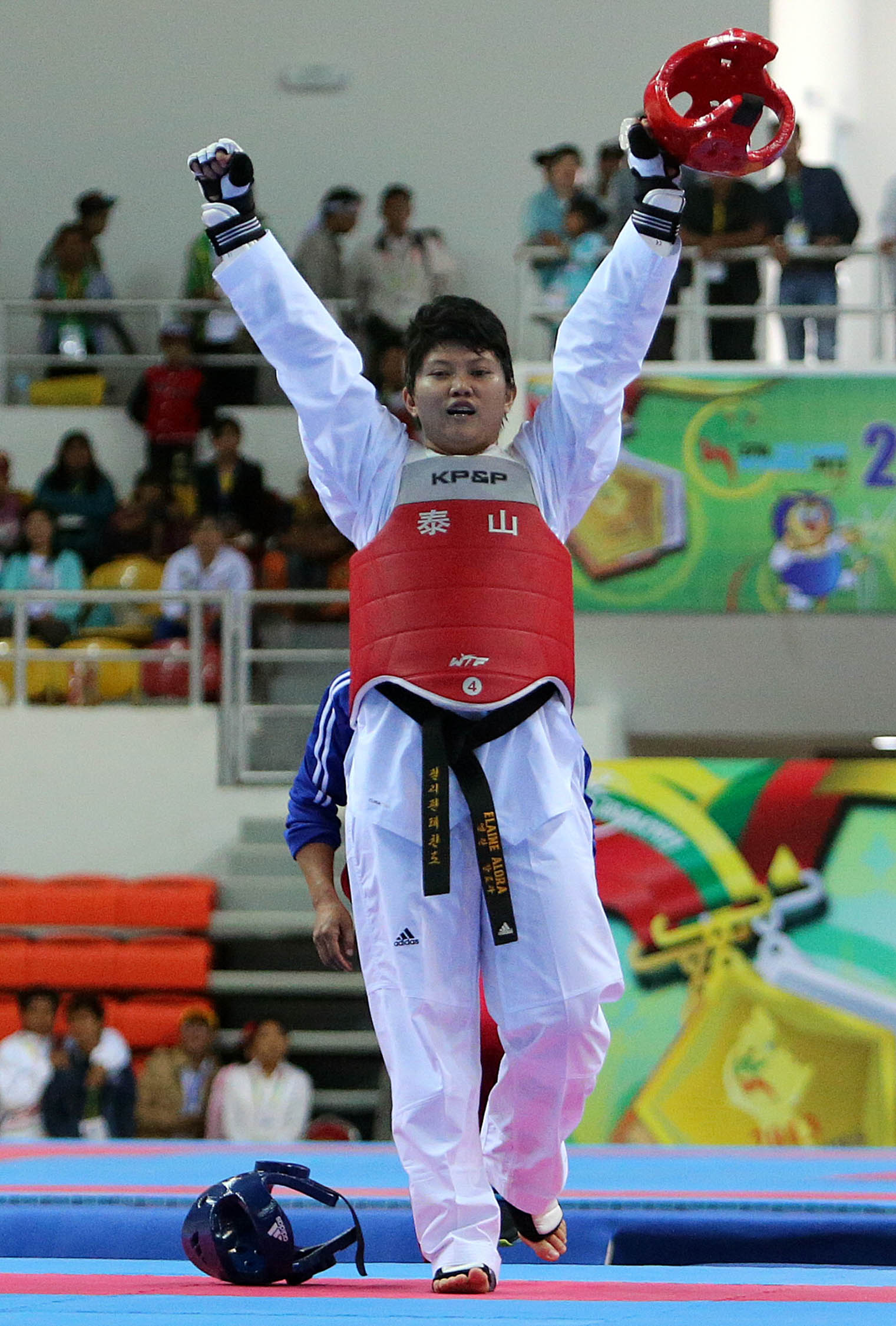 Kirstie Elaine Alora of the Philippines wins the gold after beating Davin Sorn of Camboodia during the Taekwondo, women's +73kg at the Wunna Theikdi Indoor Sports Stadium, Naypyitaw, Myanmar. INQUIRER PHOTO/RAFFY LERMA