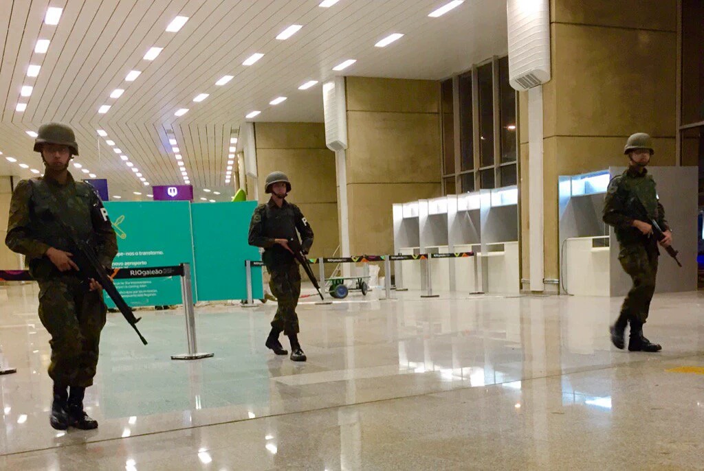 Bomb alert. Athletes Village cordoned off. Robot checking mystery luggage  at Welcome Center. Photo by Ted Melendres