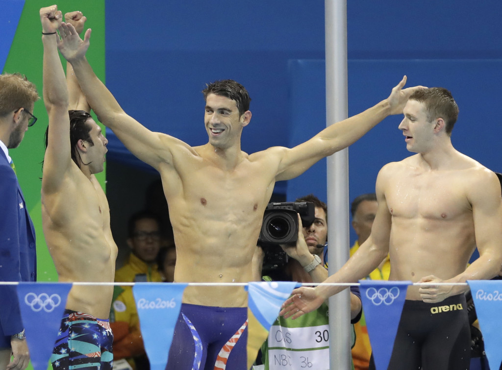 United States' Michael Phelps celebrates with teammates after winning gold in the men's 4 x 100-meter medley relay final during the swimming competitions at the 2016 Summer Olympics, Saturday, Aug. 13, 2016, in Rio de Janeiro, Brazil. (AP Photo/Rebecca Blackwell)
