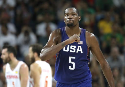 United States' Kevin Durant (5) pounds his chest after he scores against Spain during a men's semifinal round basketball game at the 2016 Summer Olympics in Rio de Janeiro, Brazil, Friday, Aug. 19, 2016. AP Photo