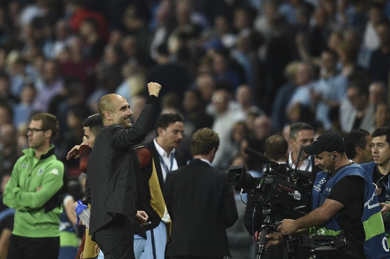 Manchester City's Spanish manager Pep Guardiola turns to wave into the crowd during the UEFA Champions League group C football match between Manchester City and Borussia Monchengladbach at the Etihad stadium in Manchester, northwest England, on September 14, 2016. AFP