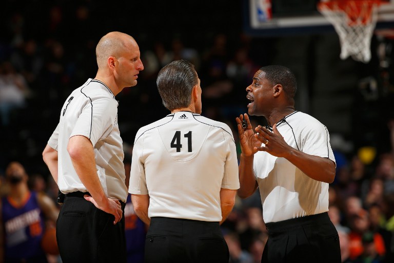 L-R) Referees Eric Dalen #37, Ken Mauer #41 and Leroy Richardson #20 talk as they oversee the action between the Phoenix Suns and the Denver Nuggets at Pepsi Center on February 25, 2015 in Denver, Colorado. The Suns defeated the Nuggets 110-96. NOTE TO USER: User expressly acknowledges and agrees that, by downloading and or using this photograph, User is consenting to the terms and conditions of the Getty Images License Agreement. Doug Pensinger/Getty Images/AFP