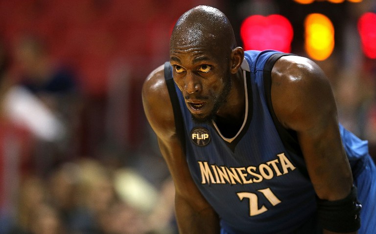 Kevin Garnett #21 of the Minnesota Timberwolves looks on during a game against the Miami Heat at American Airlines Arena on November 17, 2015 in Miami, Florida. NOTE TO USER: User expressly acknowledges and agrees that, by downloading and/or using this photograph, user is consenting to the terms and conditions of the Getty Images License Agreement. Mandatory copyright notice:   Mike Ehrmann/Getty Images/AFP