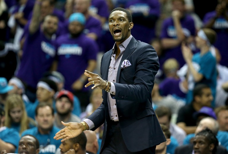 Chris Bosh #1 of the Miami Heat watches on from the bench against the Charlotte Hornets during game four of the Eastern Conference Quarterfinals of the 2016 NBA Playoffs at Time Warner Cable Arena on April 25, 2016 in Charlotte, North Carolina. NOTE TO USER: User expressly acknowledges and agrees that, by downloading and or using this photograph, User is consenting to the terms and conditions of the Getty Images License Agreement. Streeter Lecka/Getty Images/AFP