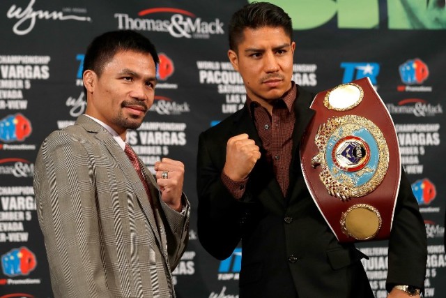 Welterweight Manny Pacquiao and Jesse Vargas pose after a press conference at the Beverly Hills Hotel on September 8, 2016 in Beverly Hills, California.   Josh Lefkowitz/Getty Images/AFP