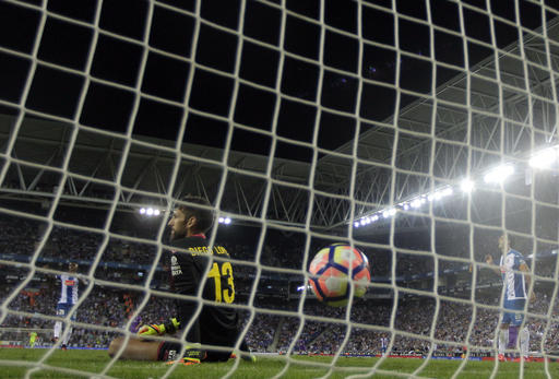 Espanyol's goalkeeper Diego Lopez reacts after Real Madrid's Karim Benzema scored during the Spanish La Liga soccer match between Espanyol and Real Madrid at RCDE stadium. AP