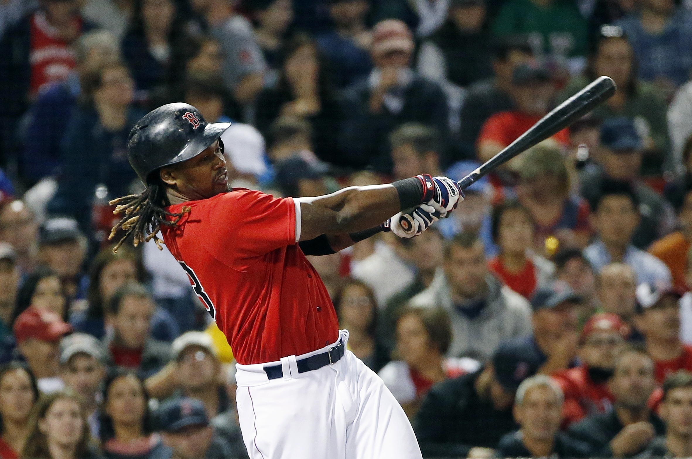 Boston Red Sox's Hanley Ramirez follows through on his solo home run during the fourth inning of a baseball game against the New York Yankees in Boston, Friday, Sept. 16, 2016. (AP Photo/Michael Dwyer)