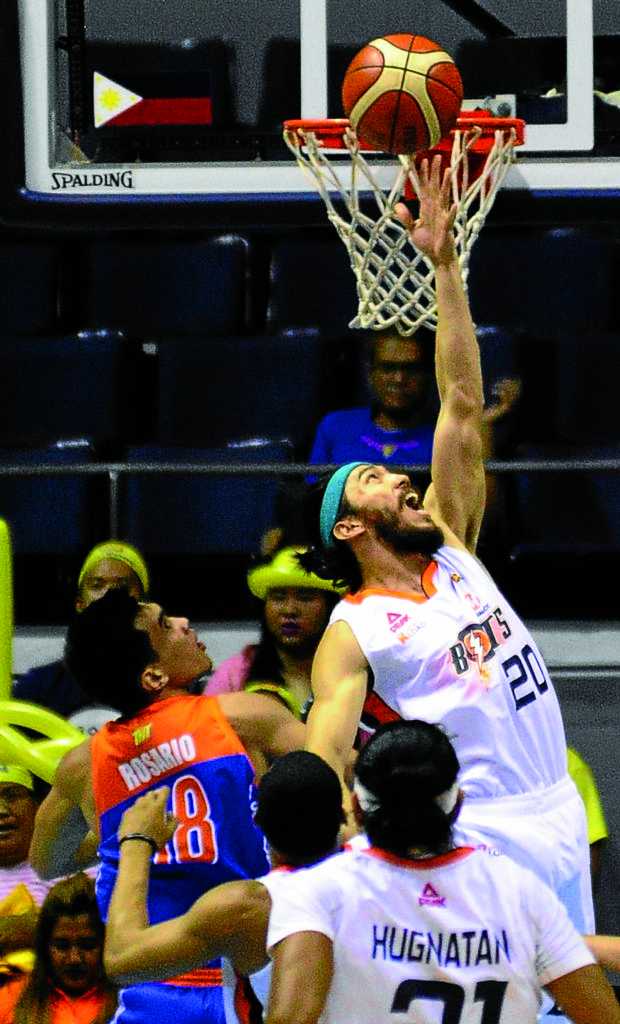 JARED Dillinger of Meralco (right) towers over Troy Rosario of TNT during last night’s Game 2 of their semifinal series at Smart Araneta Coliseum. AUGUST DELA CRUZ