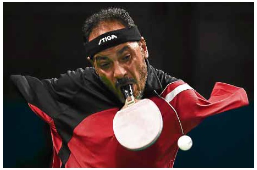 EGYPT’S Ibrahim Hamadtou competes in table tennis during the Paralympic Games in Rio. He is the sole athlete who uses hismouth in the sport after losing both arms in a childhood accident. AFP