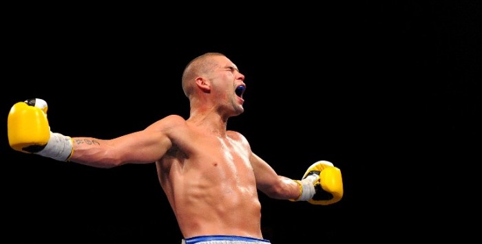 FILE - Tony Bellew celebrates after defeating Ovill McKenzie during their British light heavyweight championship boxing match at the Echo Arena in Liverpool, on July 16, 2011. AFP PHOTO/ ANDREW YATES / AFP PHOTO / ANDREW YATES