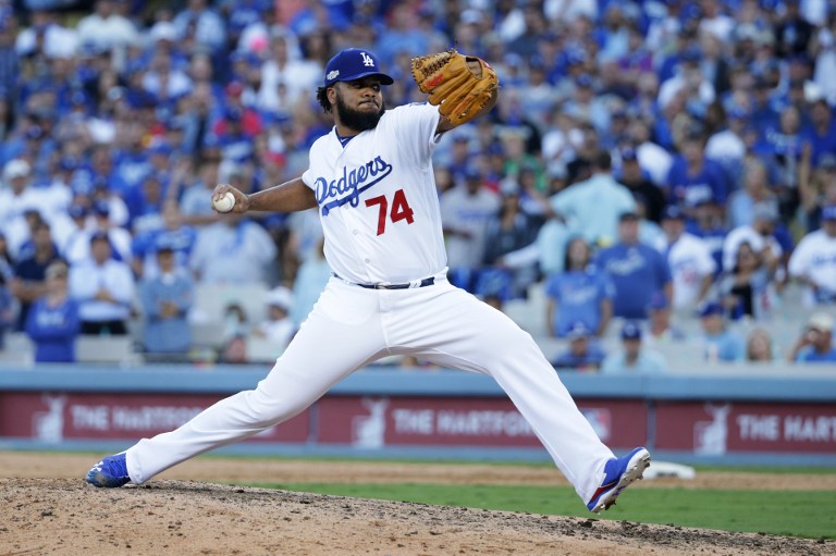 Kenley Jansen #74 of the Los Angeles Dodgers pitches in the ninth inning against the Washington Nationals during game four of the National League Division Series at Dodger Stadium on October 11, 2016 in Los Angeles, California.   Jeff Gross/Getty Images/AFP