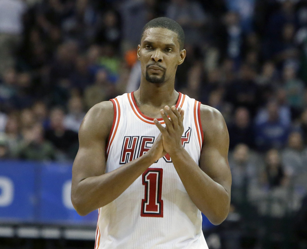 FILE - In this Feb. 3, 2016, file photo, Miami Heat forward Chris Bosh (1) reacts to a call during the second half of an NBA basketball game against the Dallas Mavericks, in Dallas. Bosh was dealing with more than one blood clot earlier this year, and said Wednesday, Sept. 21, 2016,  that he felt written off when Miami Heat team doctors advised him that the situation would likely be career-ending. (AP Photo/LM Otero, File)