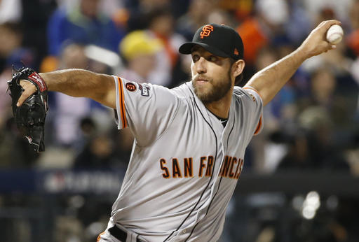 San Francisco Giants starting pitcher Madison Bumgarner (40) winds up during the first inning of a National League wild-card baseball game against the New York Mets. AP