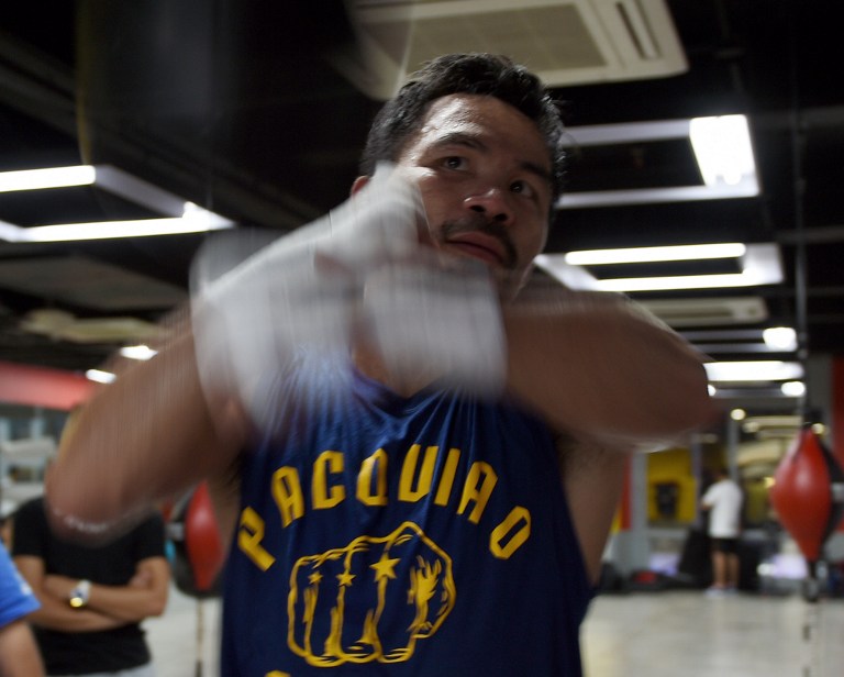In this photo taken on September 29, 2016, Philippine boxing icon Manny Pacquiao trains at a gym in Manila, ahead of his November 6 bout with Mexican boxer Jessie Vargas.  Pacquiao insisted September 30 he owed his fans and countrymen no apology after admitting to having used illegal drugs. / AFP PHOTO / TED ALJIBE